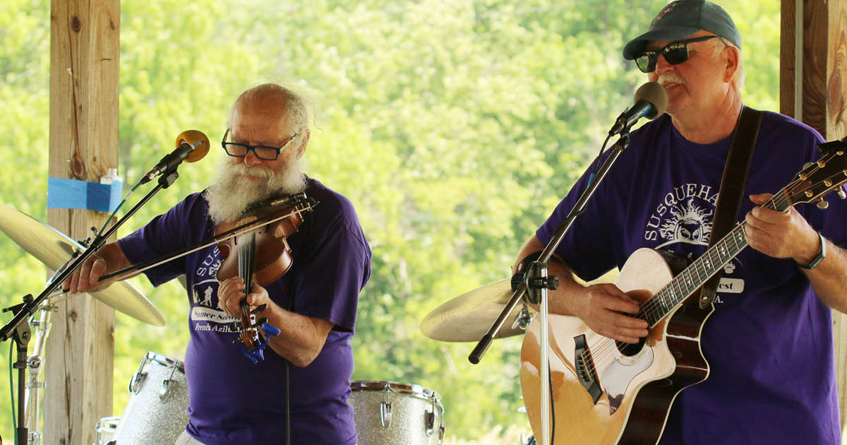 blue-stone-revival_600x600 Dan Fassett on fiddle and Joe Tewksbury on guitar playing an outdoor concert at French Azilum