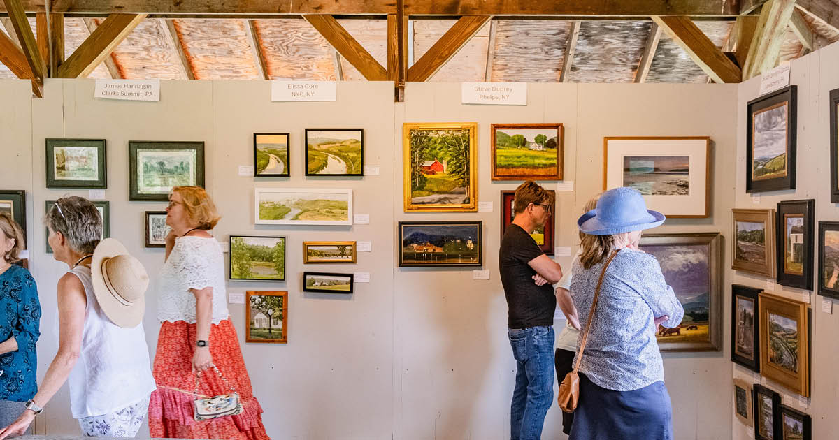 Festival attendees view new plein-air paintings in the Pavilion Gallery